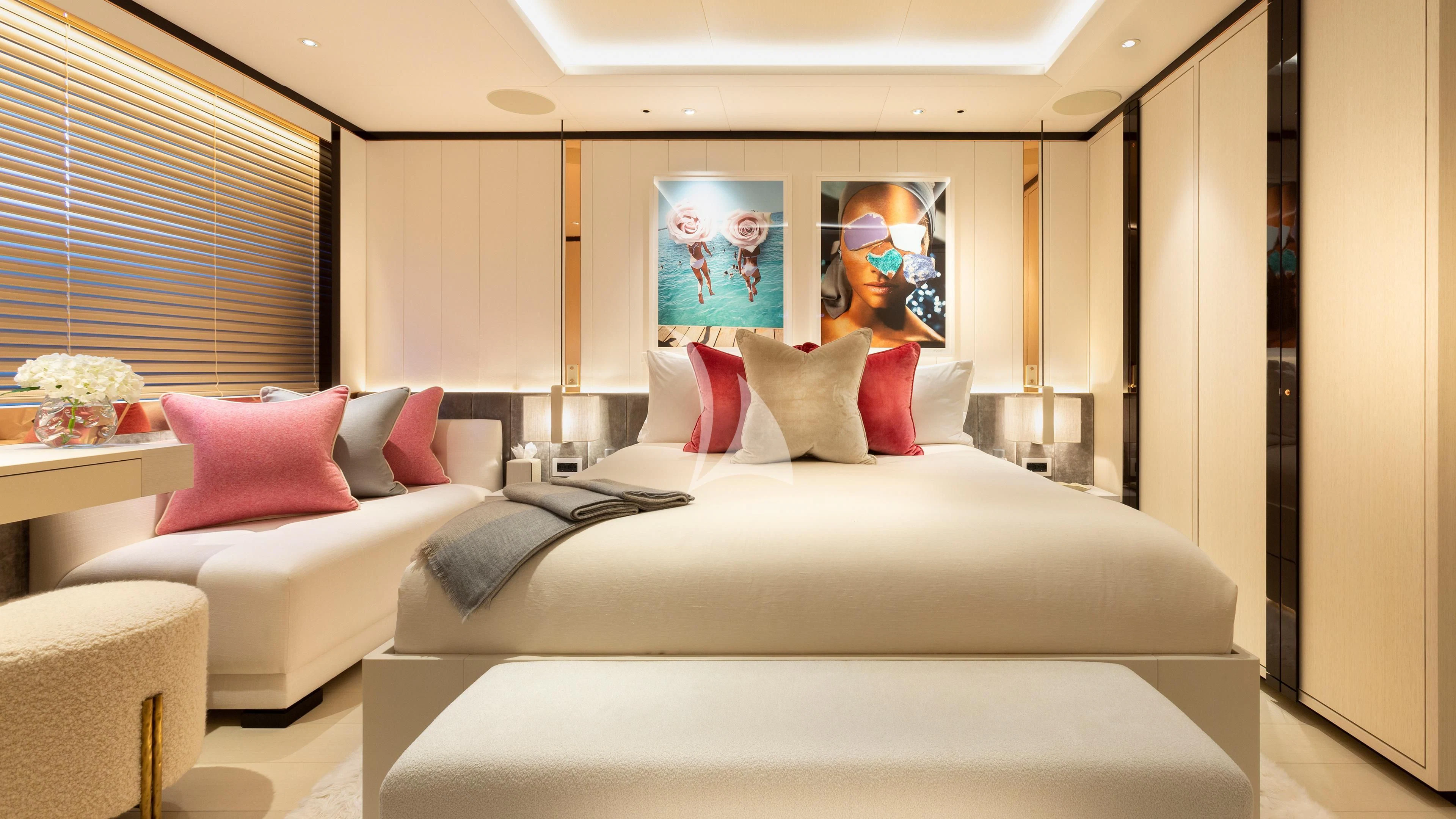 a room with a bed and a couch aboard LUNASEA Yacht for Sale