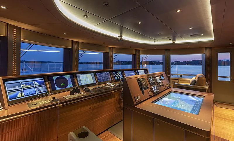 a room with a large display of screens and a pool table aboard LUNASEA Yacht for Sale