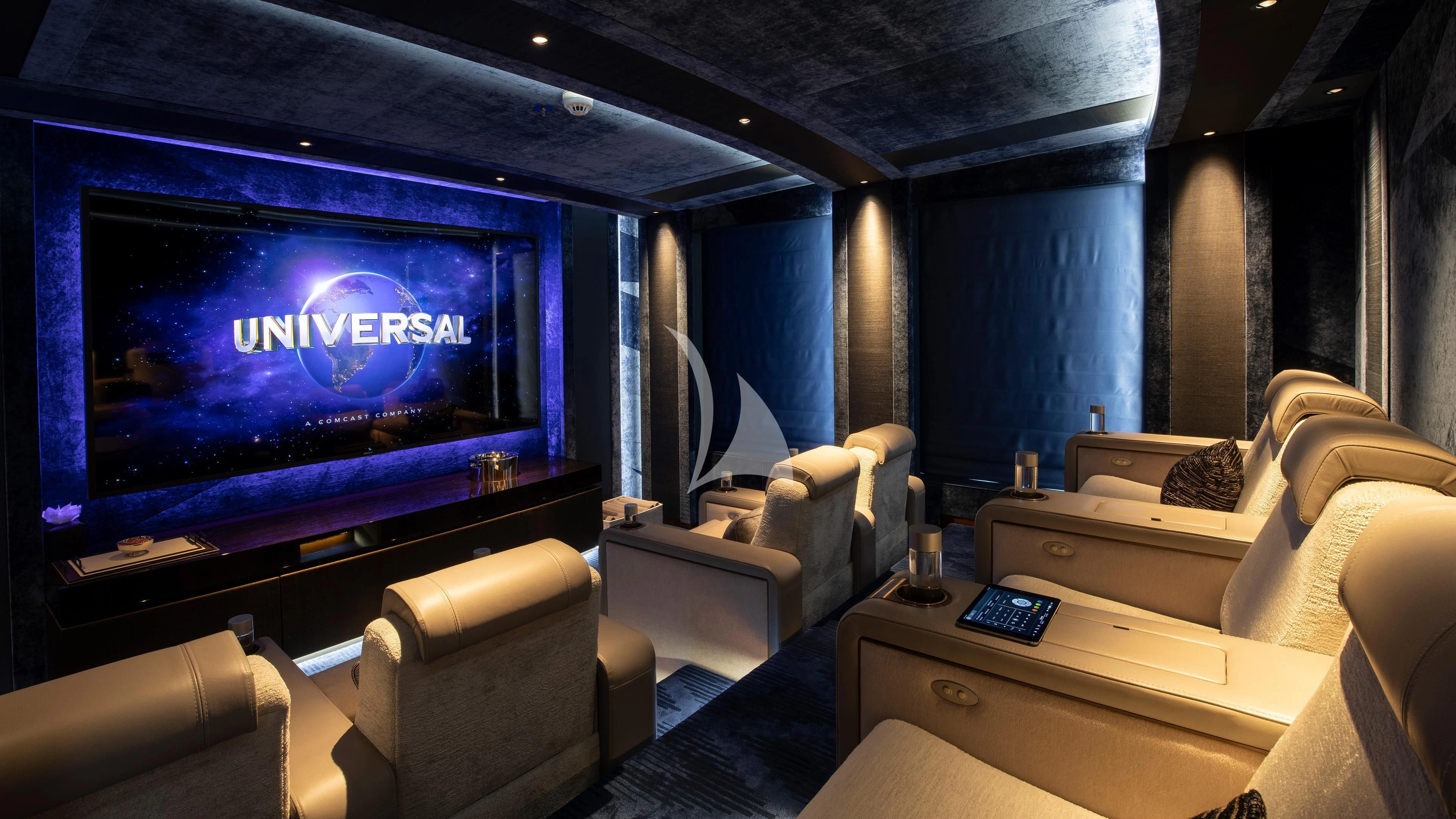a room with a tv and a couch aboard LUNASEA Yacht for Sale