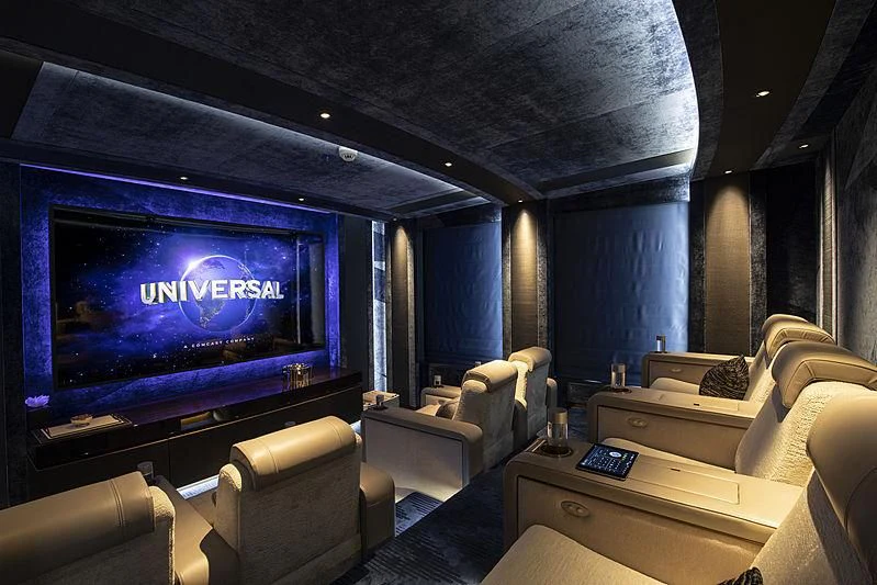 a large screen in a room aboard LUNASEA Yacht for Sale