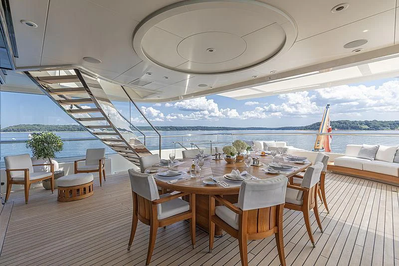 a room with a table and chairs aboard LUNASEA Yacht for Sale