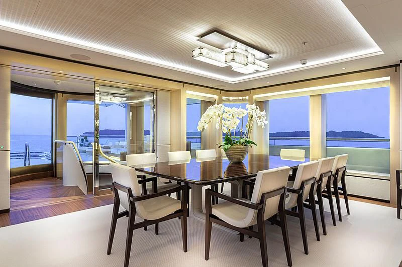 a dining room with a large window aboard LUNASEA Yacht for Sale