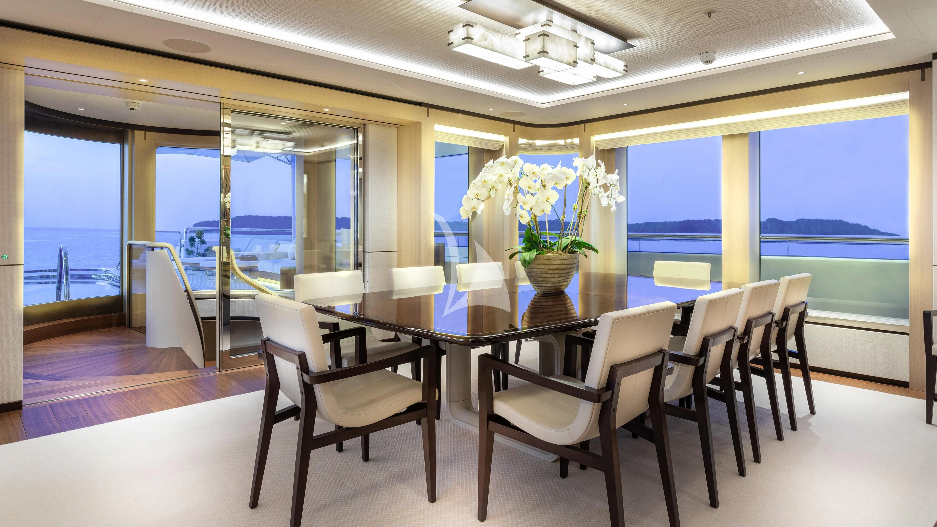 a dining room with a large window aboard LUNASEA Yacht for Sale
