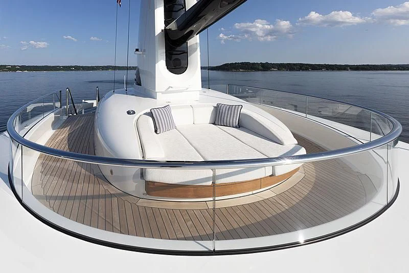 a white boat on a body of water aboard LUNASEA Yacht for Sale