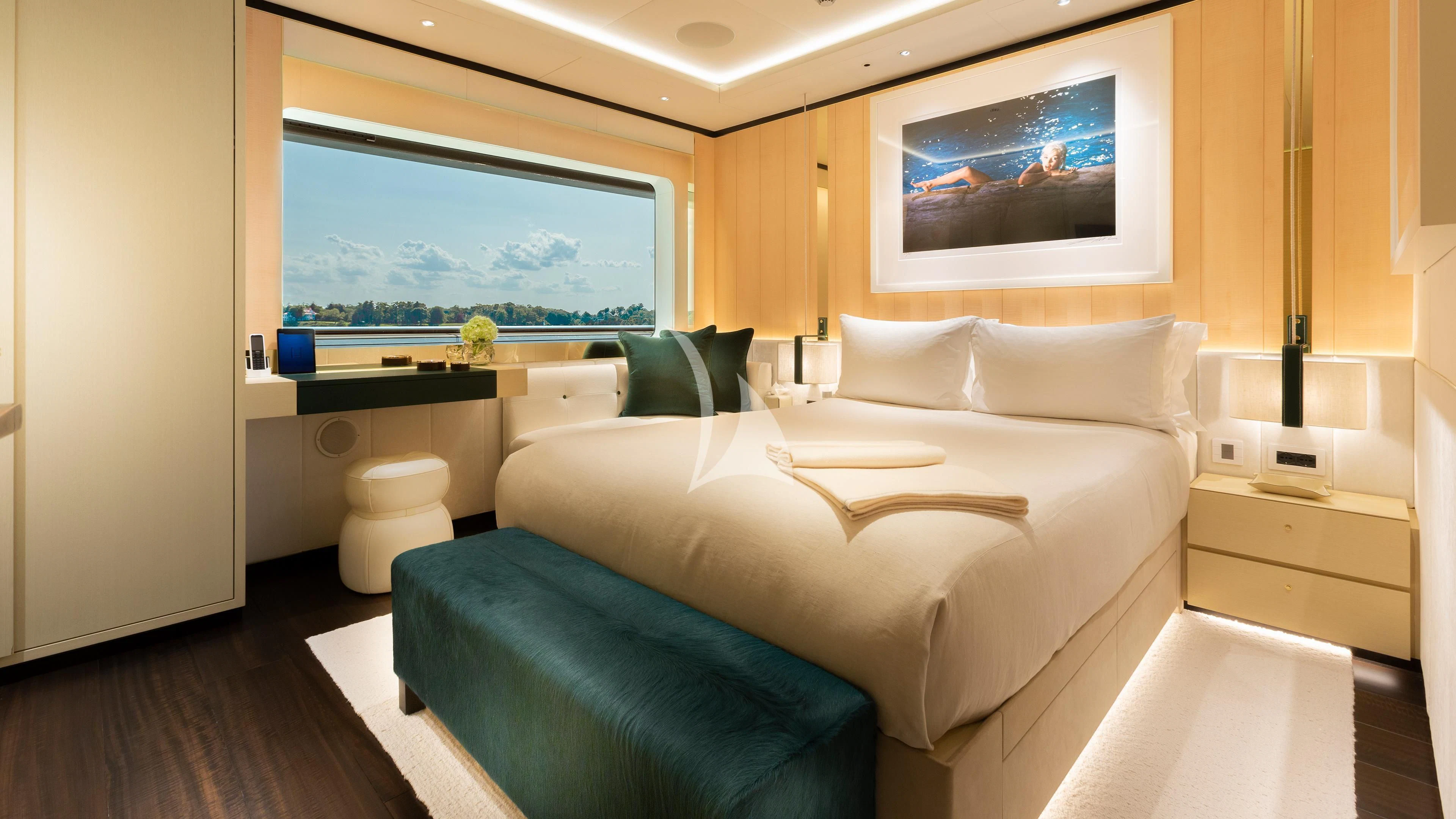a room with a bed and a couch aboard LUNASEA Yacht for Sale