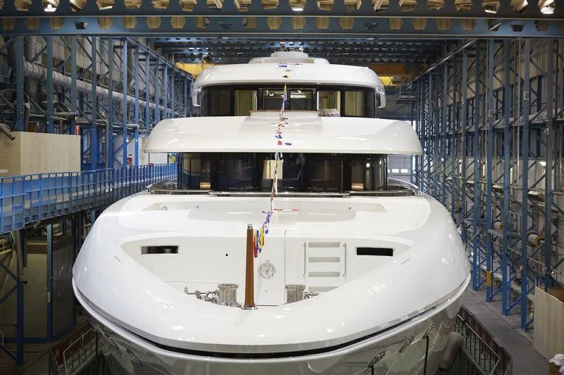 a white boat in a warehouse aboard LUNASEA Yacht for Sale