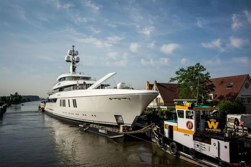 a boat docked next to a boat aboard LUNASEA Yacht for Sale