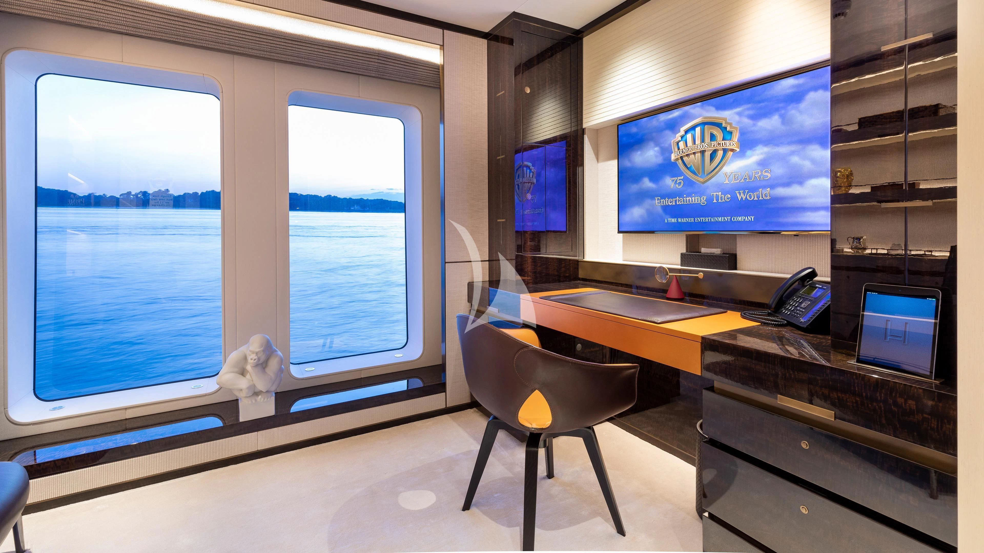a room with a desk and a computer aboard LUNASEA Yacht for Sale