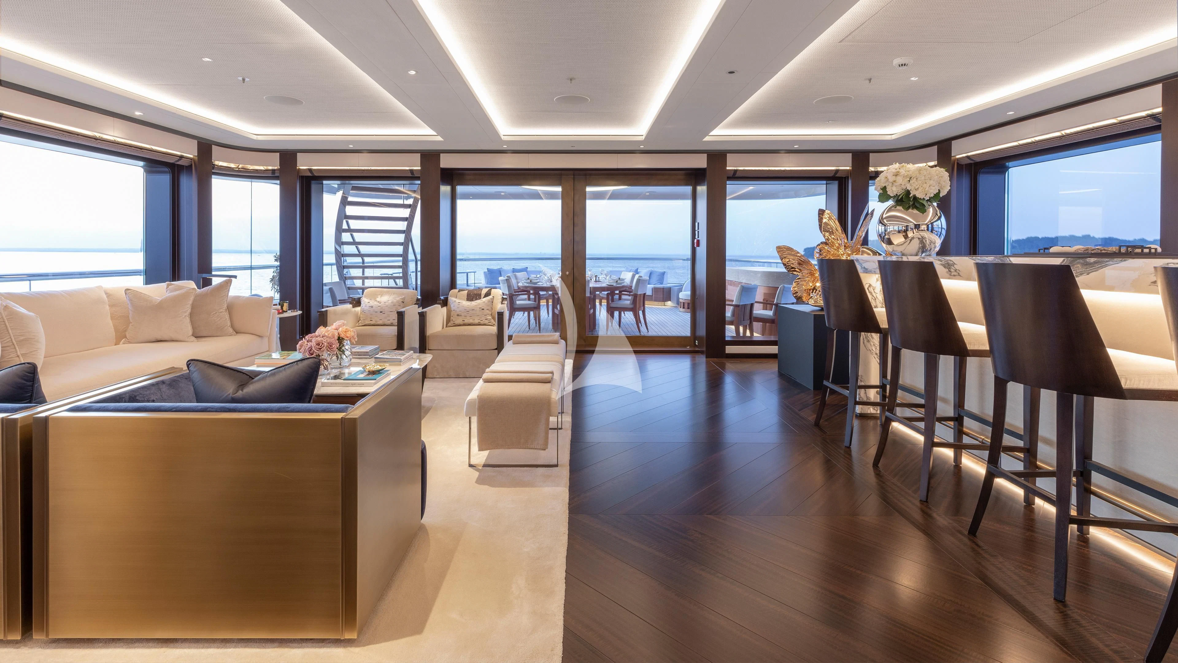 a room with a wood floor and a wood floor and a large window aboard LUNASEA Yacht for Sale