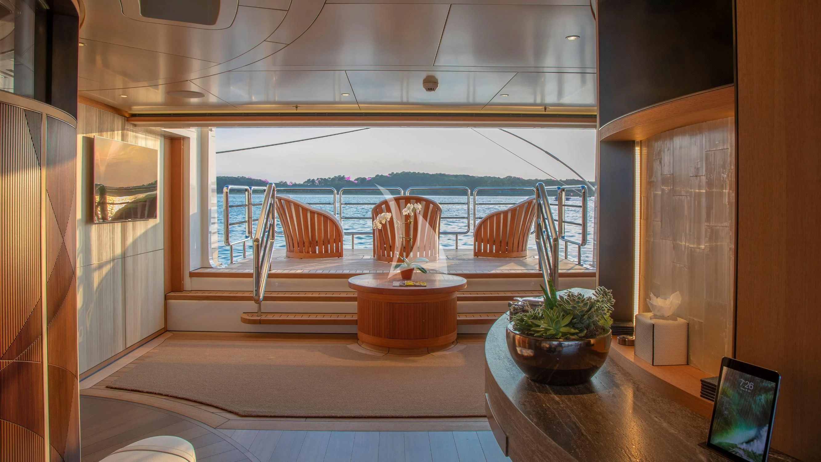 a room with a table and chairs aboard LUNASEA Yacht for Sale
