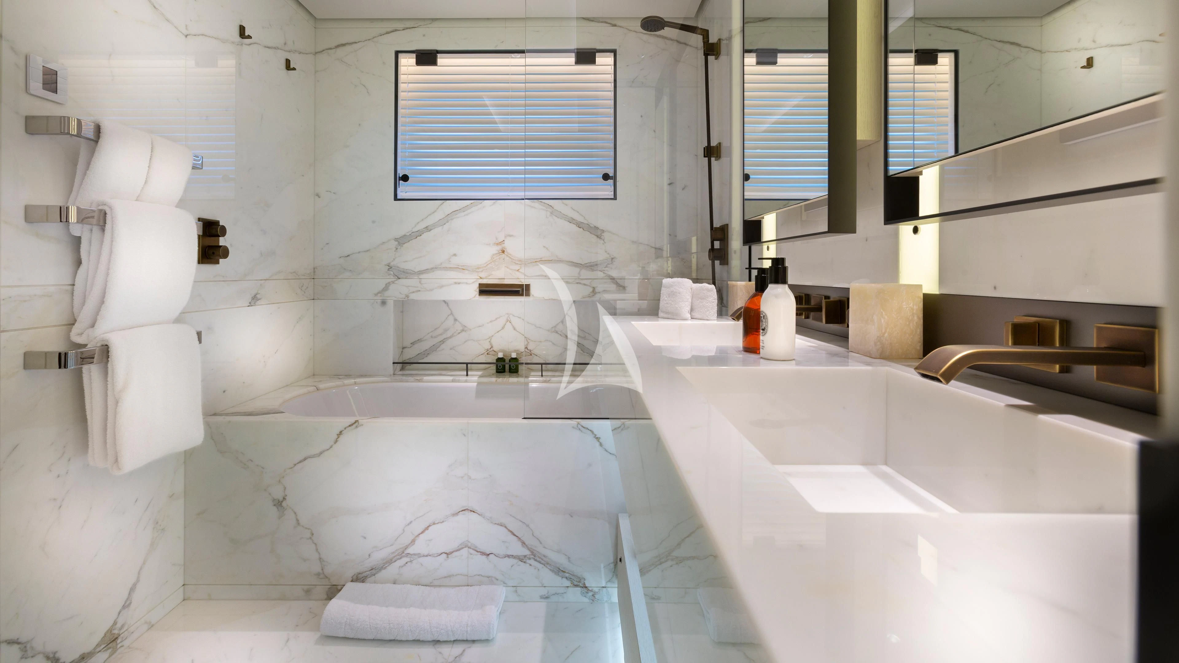 a bathroom with a tub sink and a window aboard LUNASEA Yacht for Sale