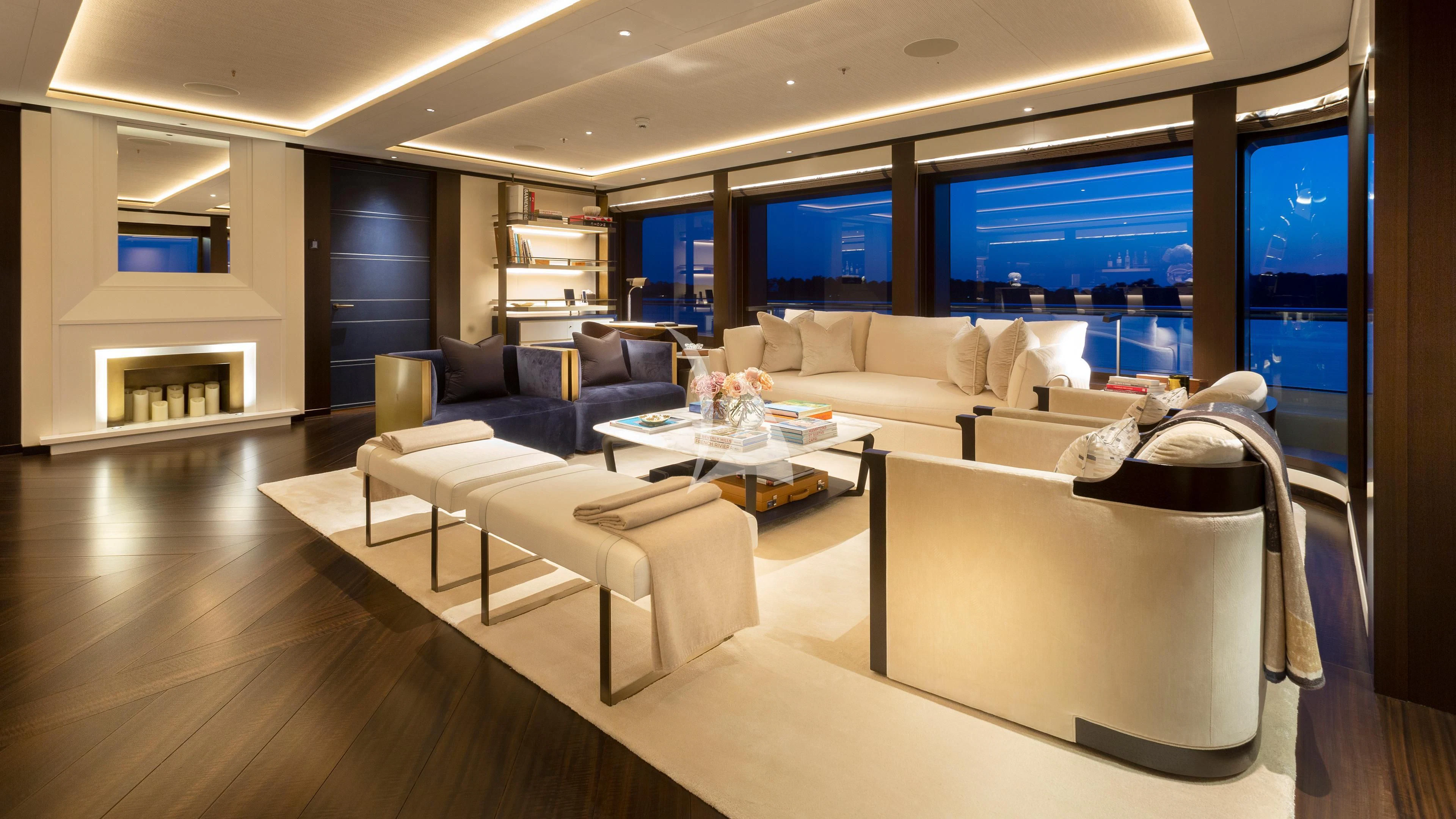 a living room with a large screen aboard LUNASEA Yacht for Sale
