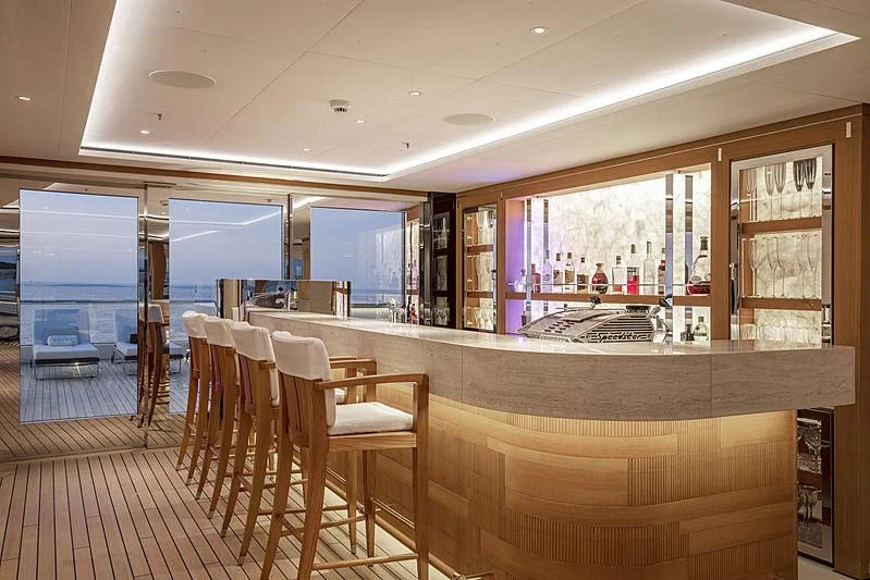 a room with a table chairs and a window aboard LUNASEA Yacht for Sale