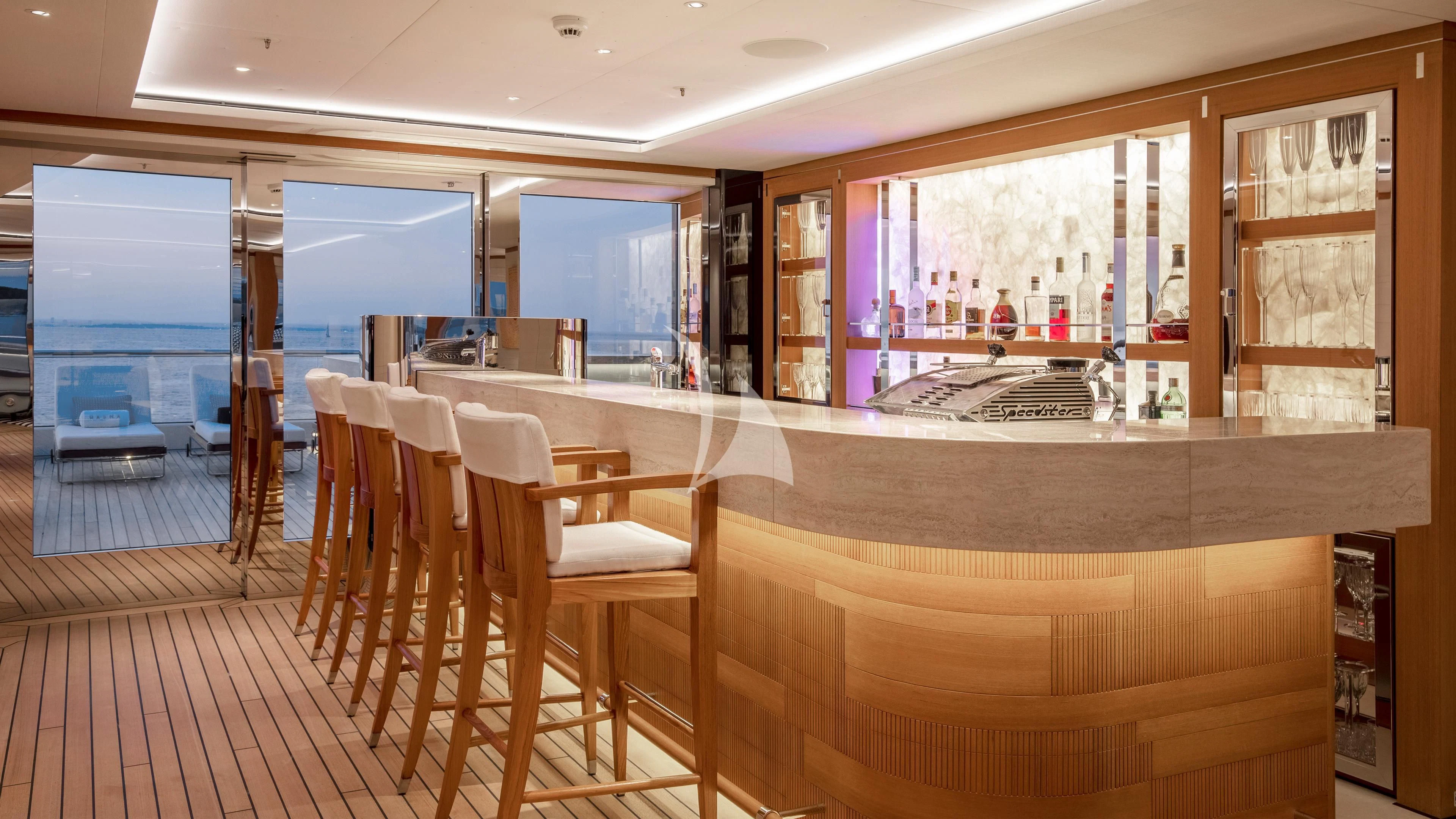 a room with a table and chairs aboard LUNASEA Yacht for Sale