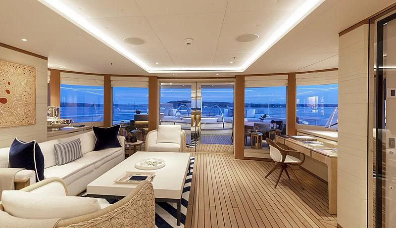 a room with a table chairs and a large window aboard LUNASEA Yacht for Sale