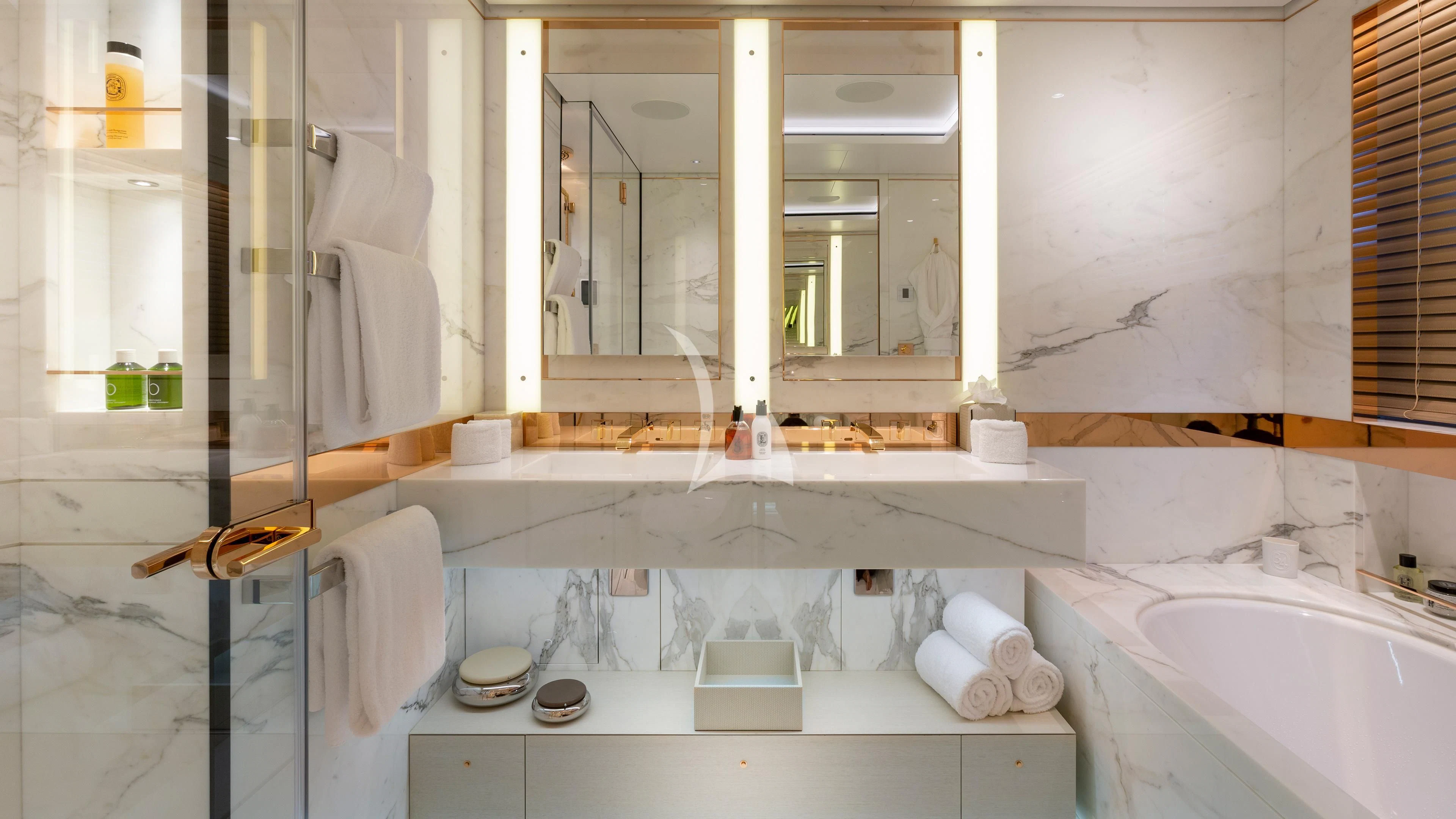 a bathroom with a tub sink and mirror aboard LUNASEA Yacht for Sale