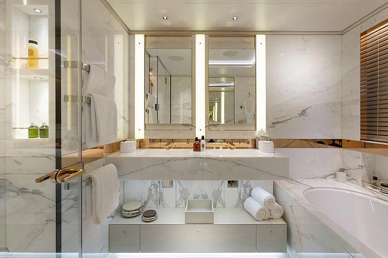 a bathroom with a large mirror aboard LUNASEA Yacht for Sale