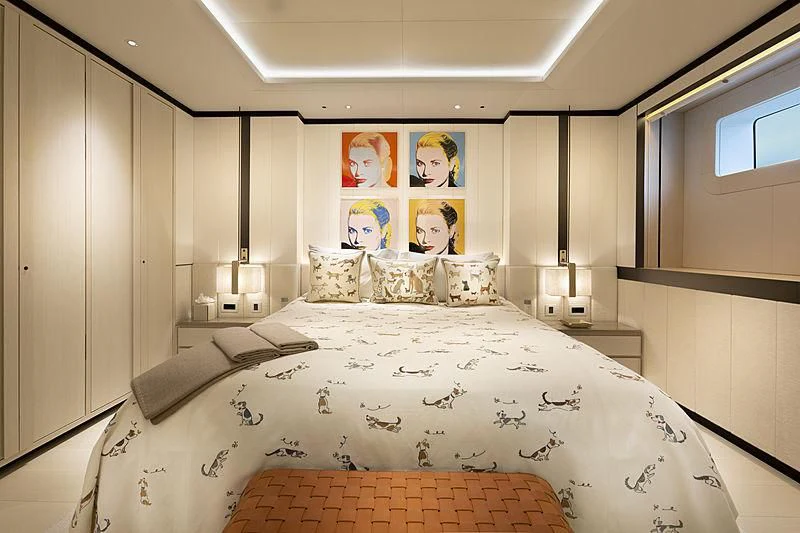 a bed with a white sheet aboard LUNASEA Yacht for Sale