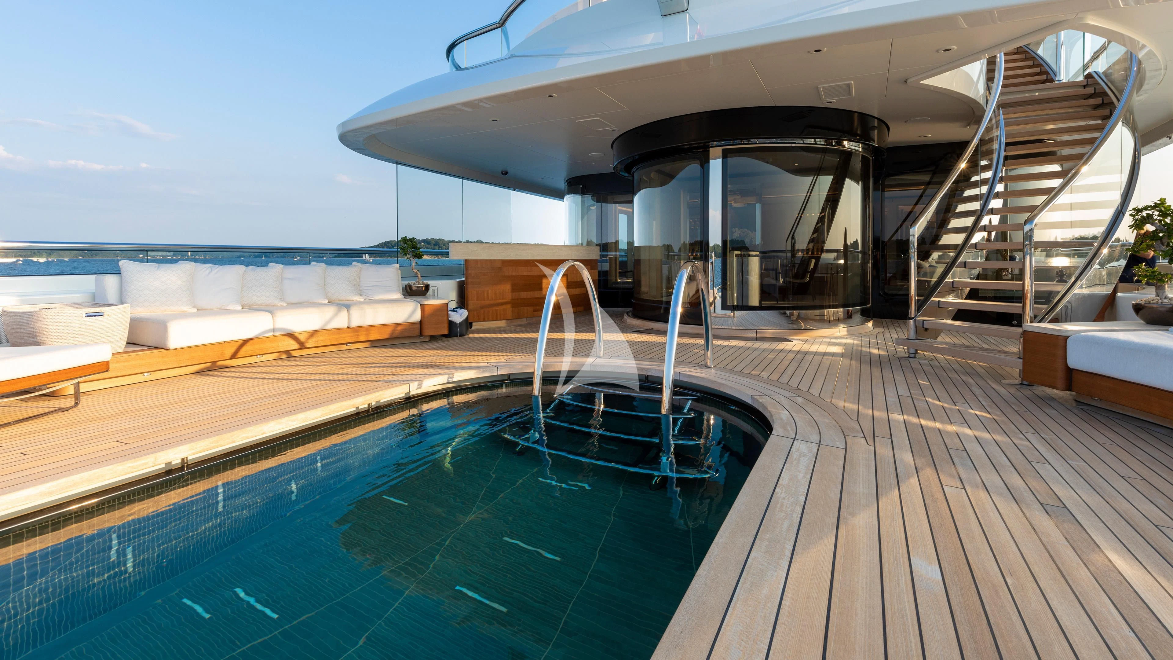 a pool with a deck and a slide aboard LUNASEA Yacht for Sale