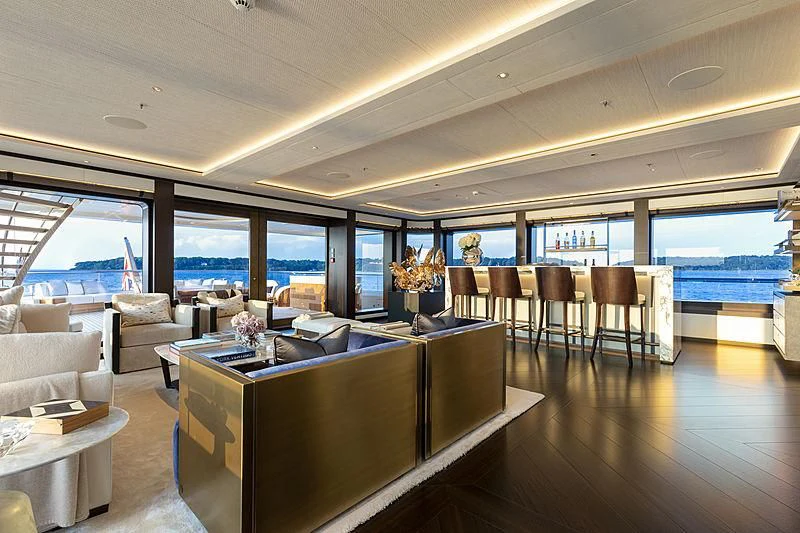 a room with a table and chairs aboard LUNASEA Yacht for Sale