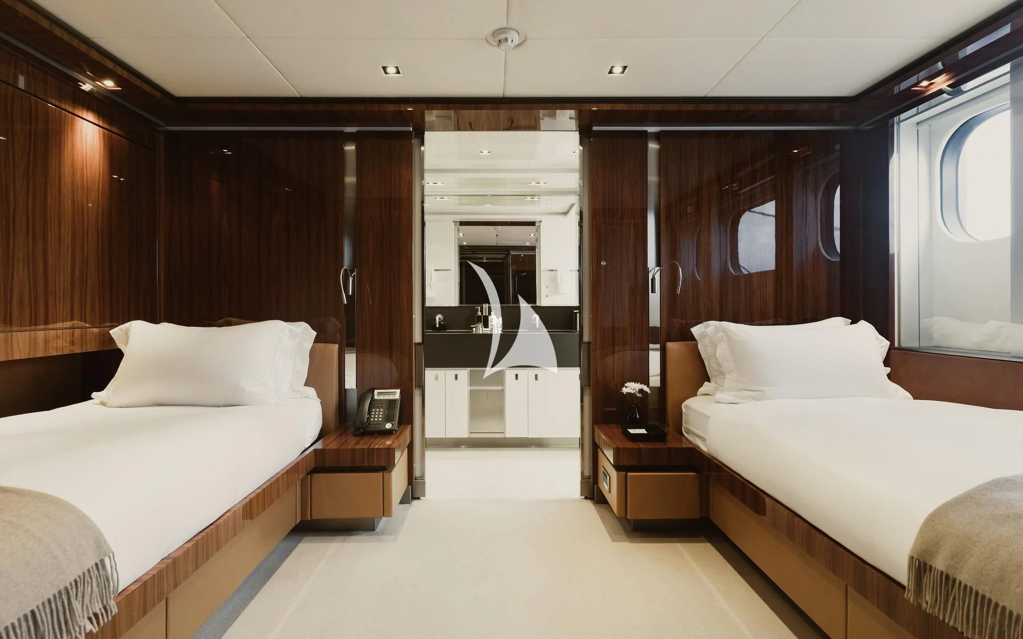 a room with a bed and a mirror aboard TOTEM Yacht for Sale