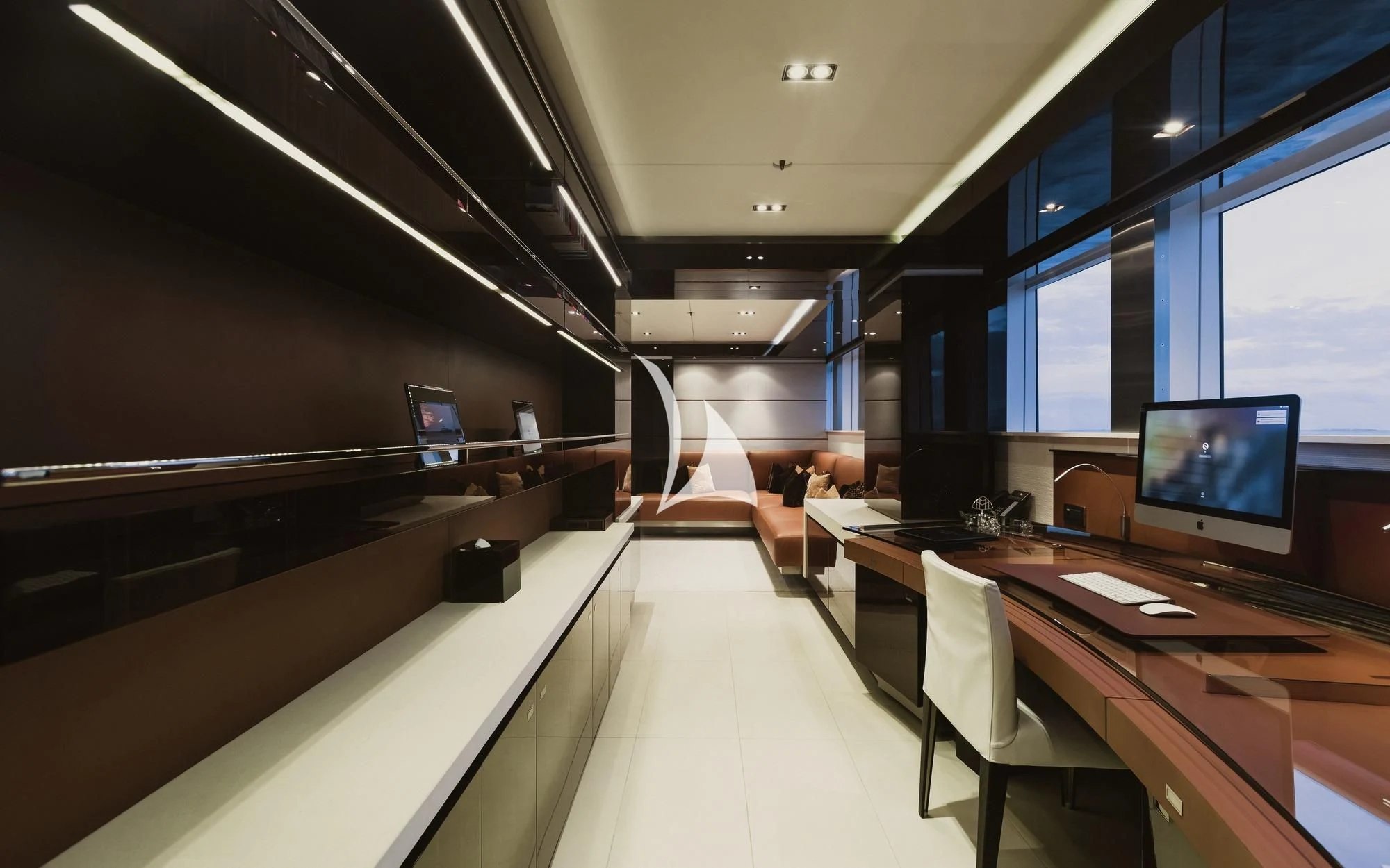 a room with a desk and chairs aboard TOTEM Yacht for Sale