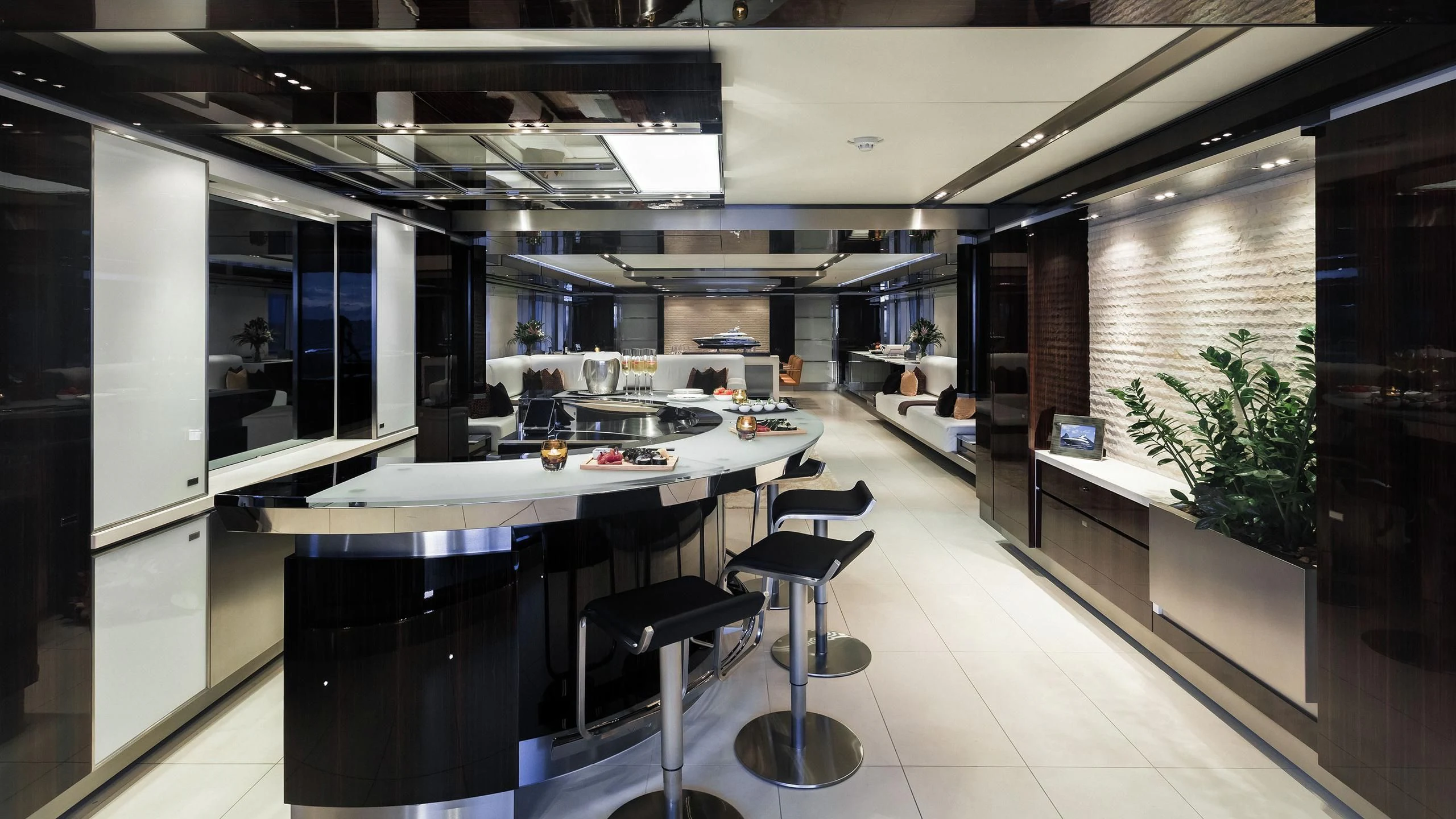 a large room with a table and chairs aboard TOTEM Yacht for Sale