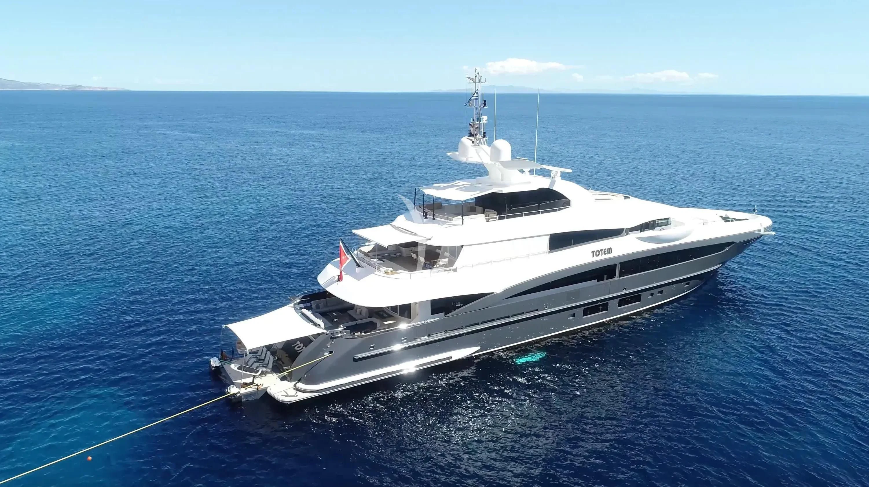 a white yacht in the water aboard TOTEM Yacht for Sale