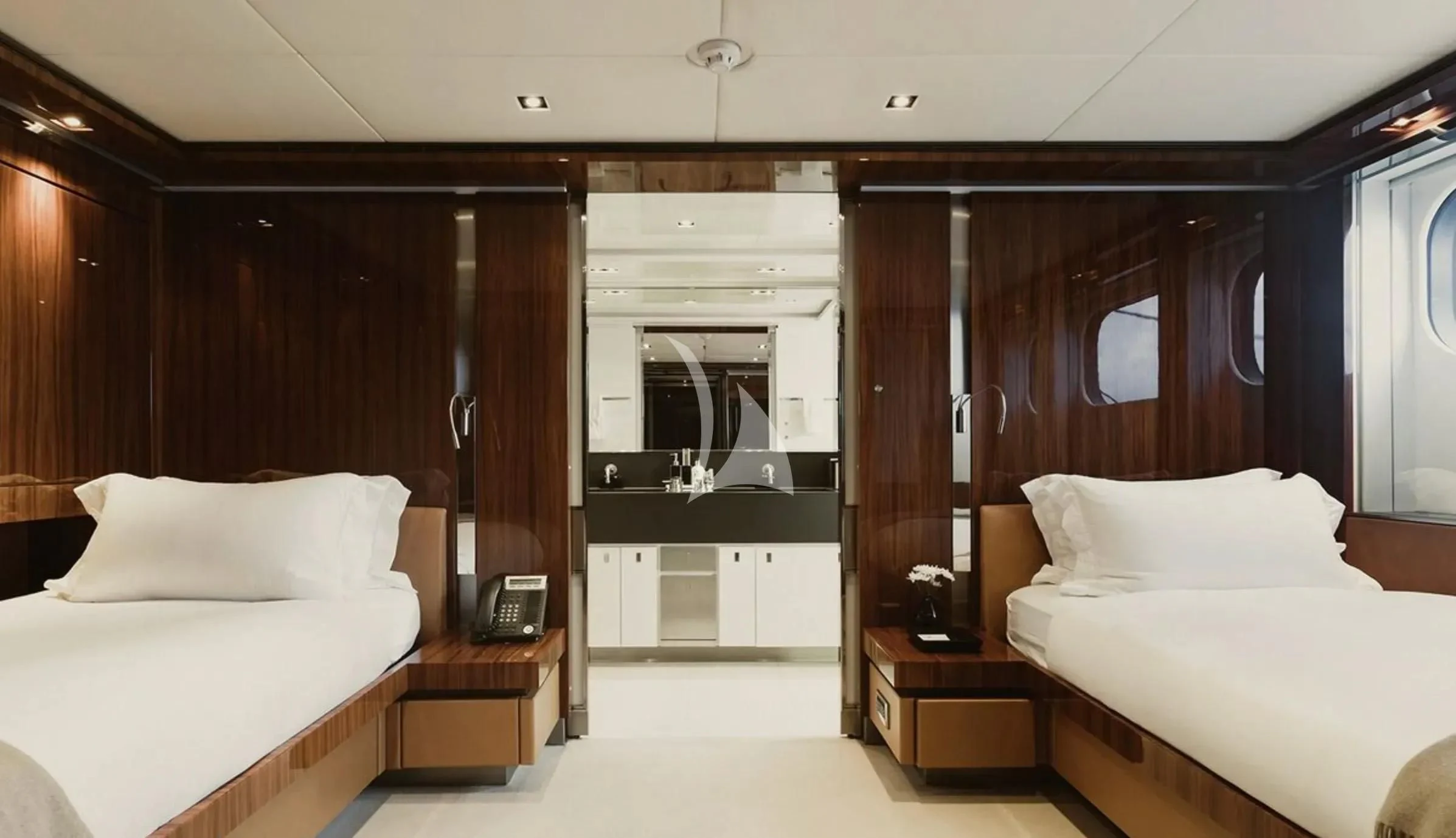 a room with beds and a mirror aboard TOTEM Yacht for Sale