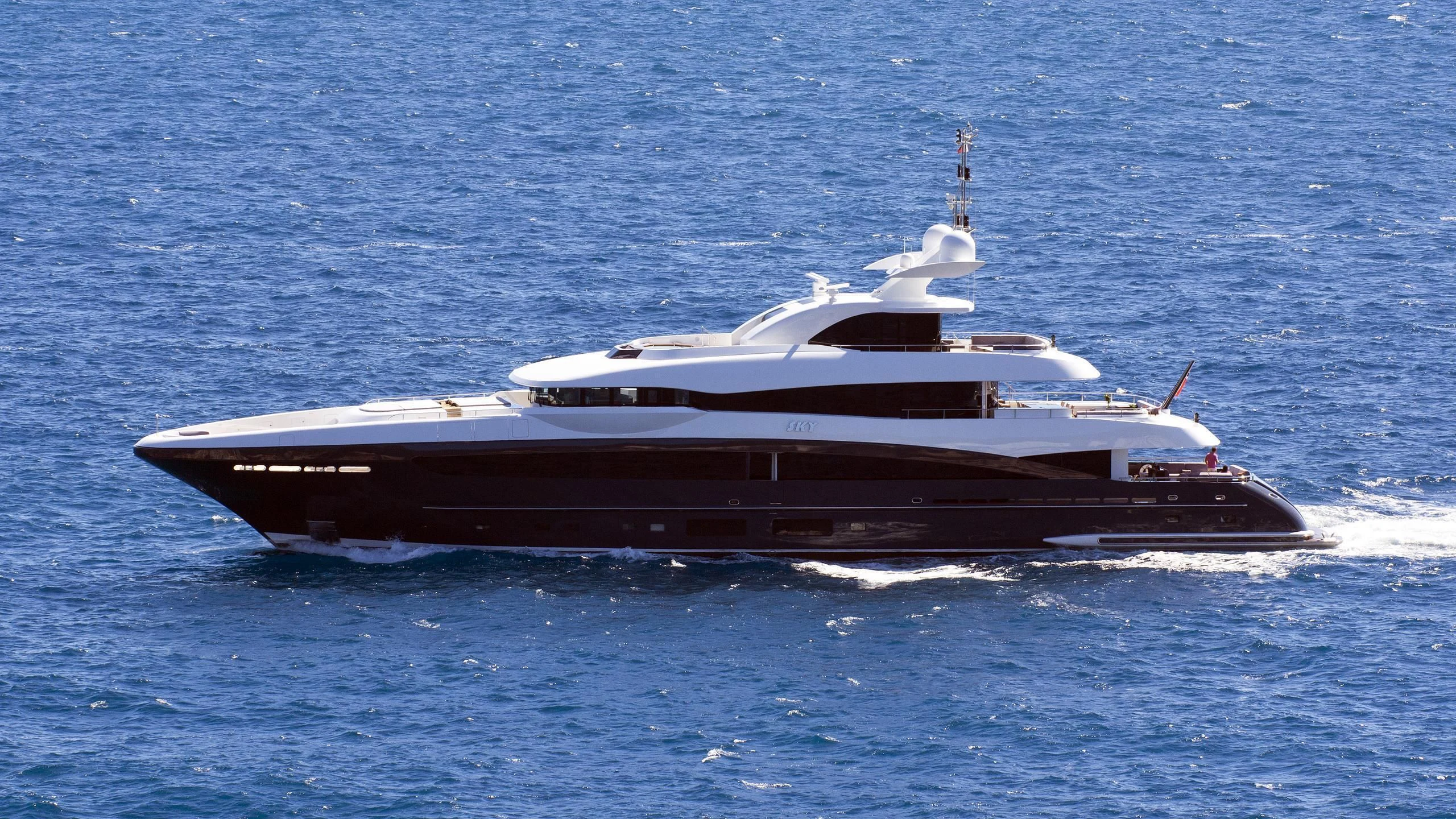 a large ship in the water aboard TOTEM Yacht for Sale