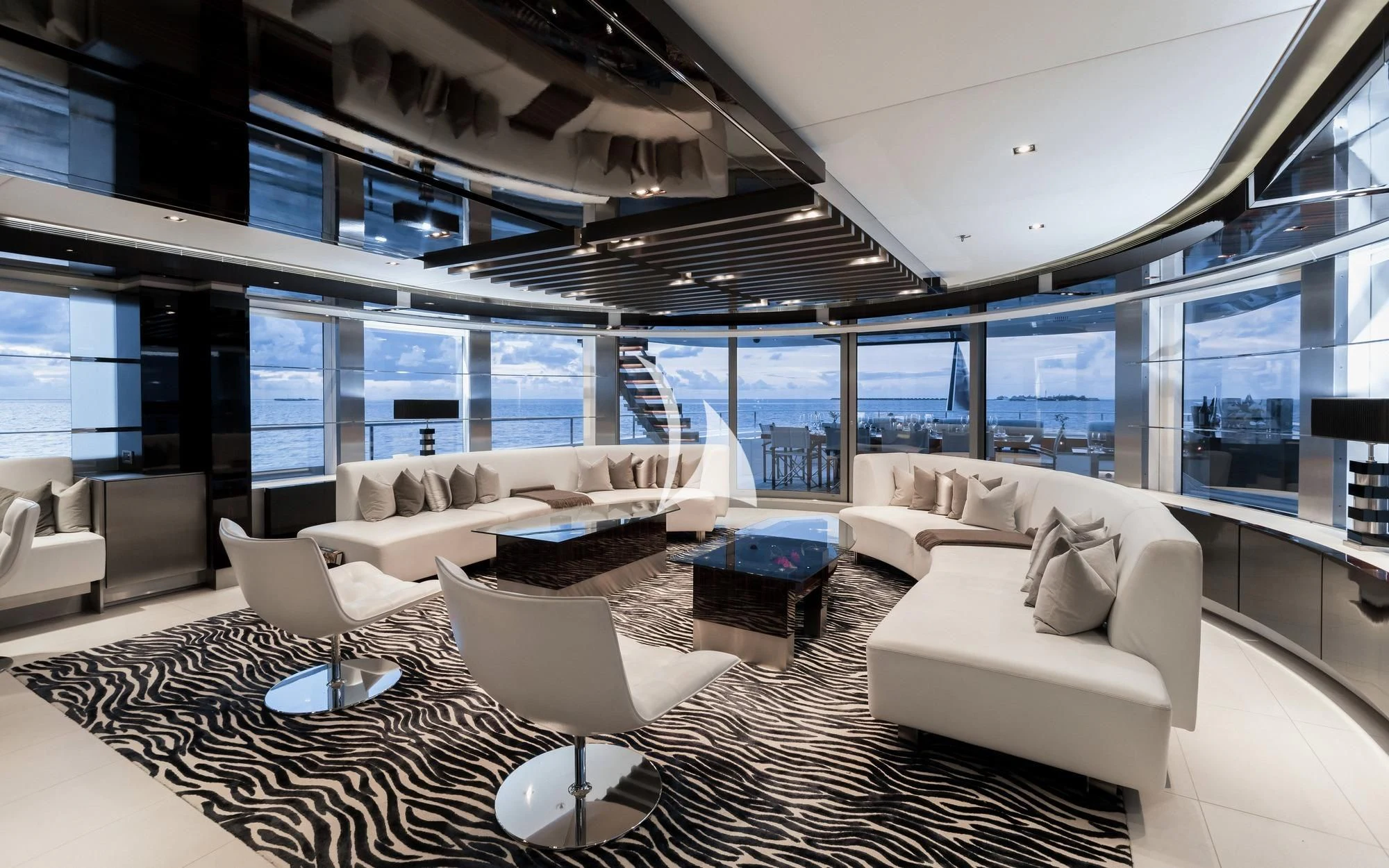 a living room with white furniture aboard TOTEM Yacht for Sale