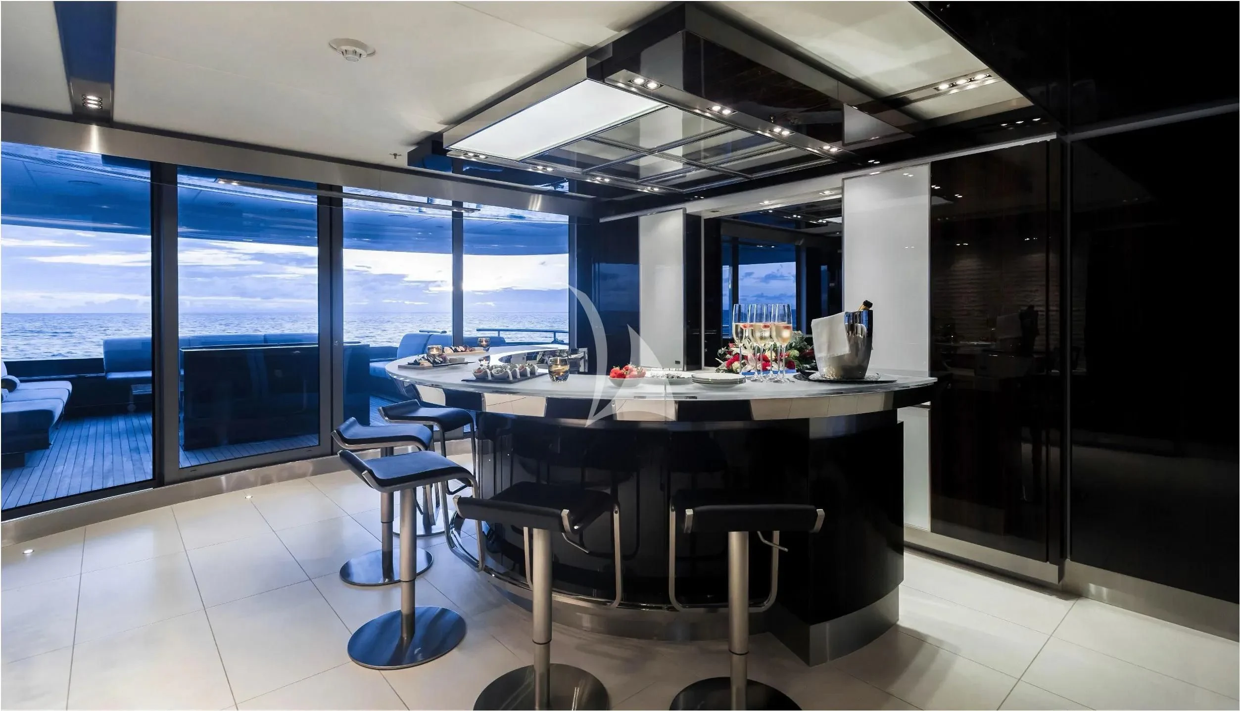 a room with a table and chairs aboard TOTEM Yacht for Sale