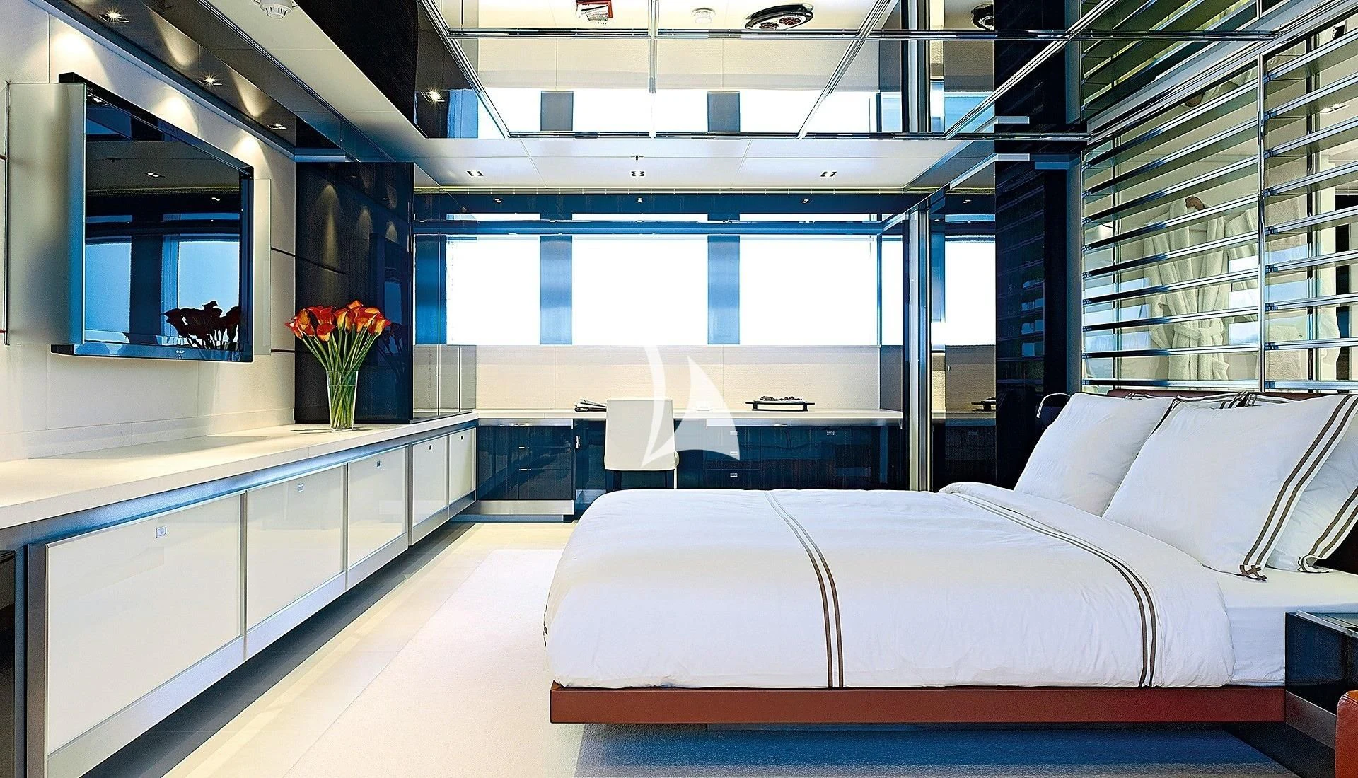 a room with a bed and a desk aboard TOTEM Yacht for Sale