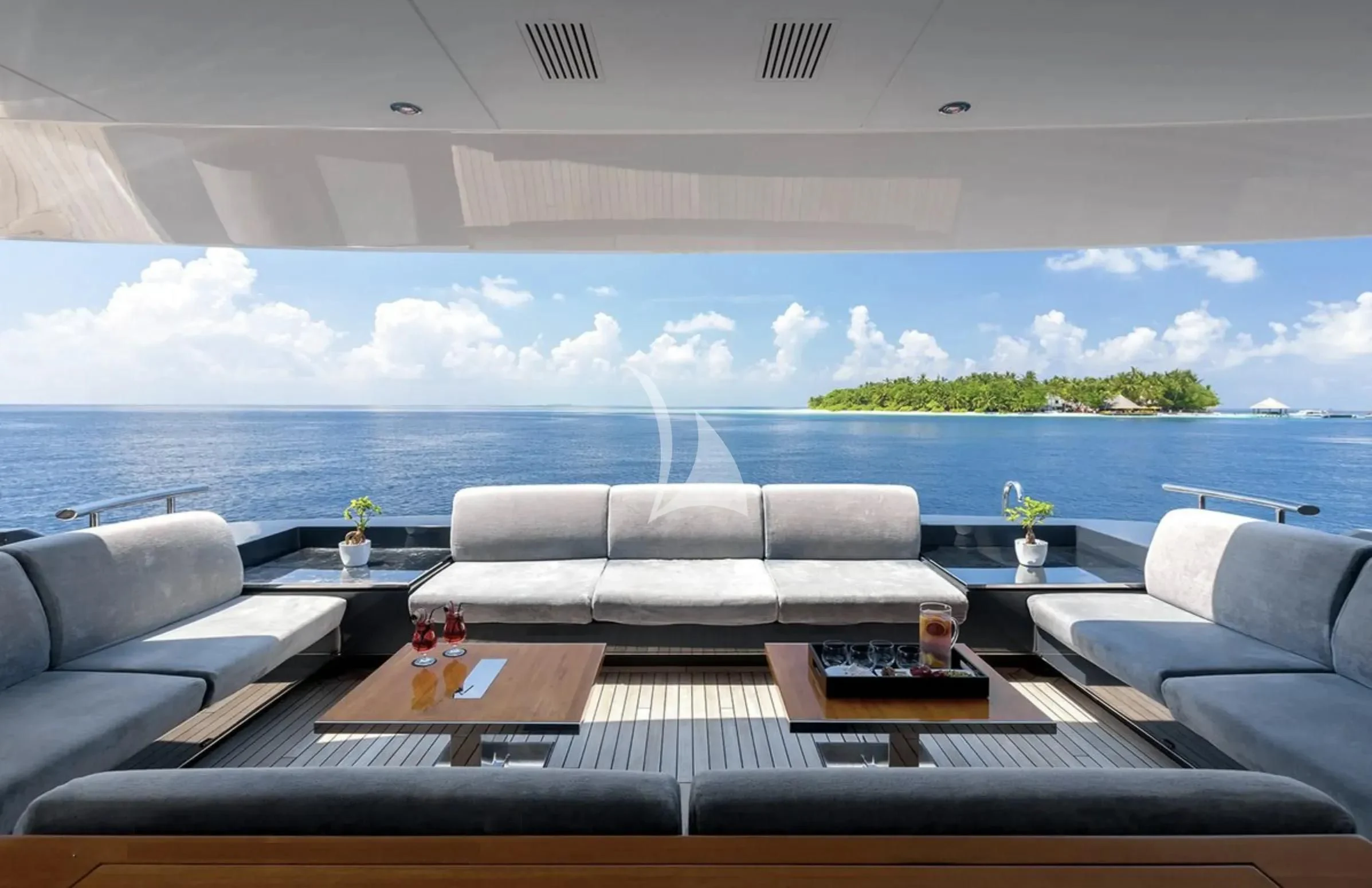 a living room with a large body of water aboard TOTEM Yacht for Sale
