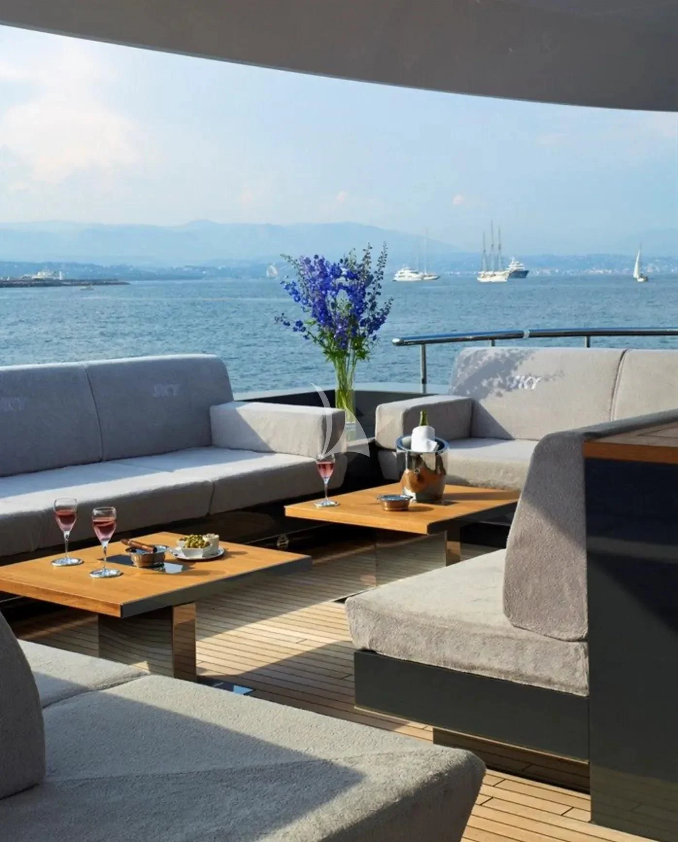 a living room with a large body of water and a plant aboard TOTEM Yacht for Sale