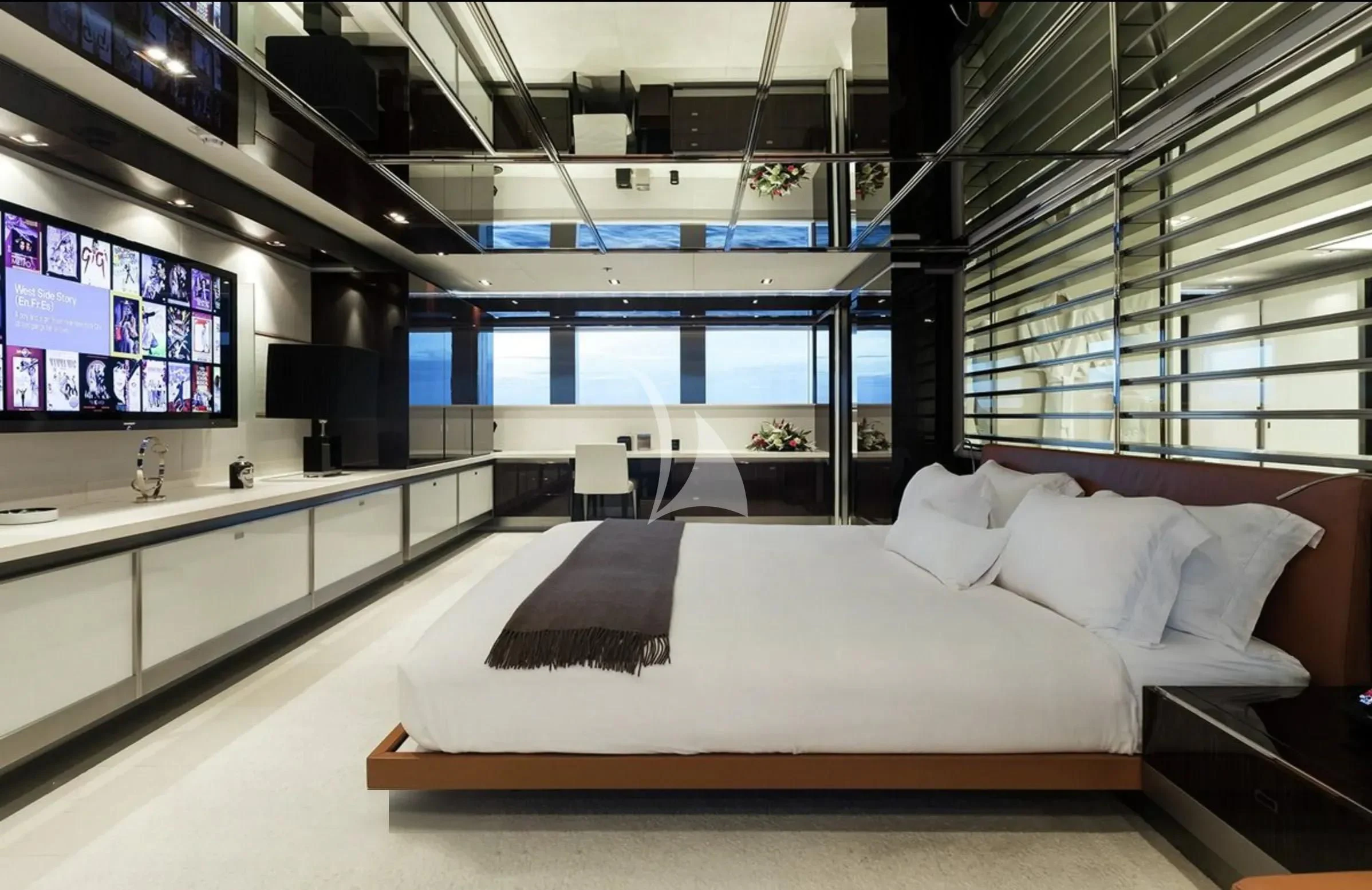 a room with a bed and a tv aboard TOTEM Yacht for Sale