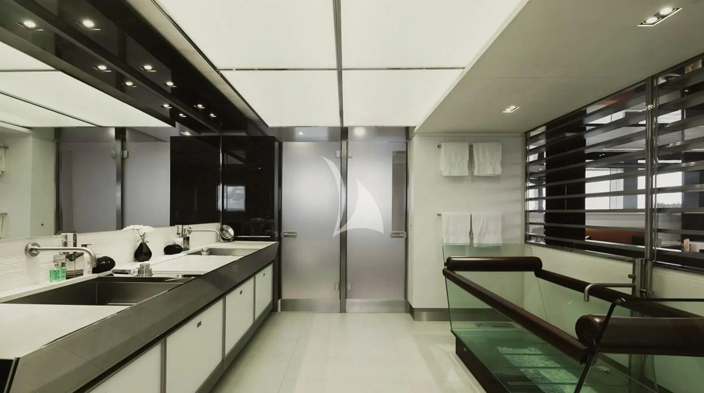 a large kitchen with a table aboard TOTEM Yacht for Sale