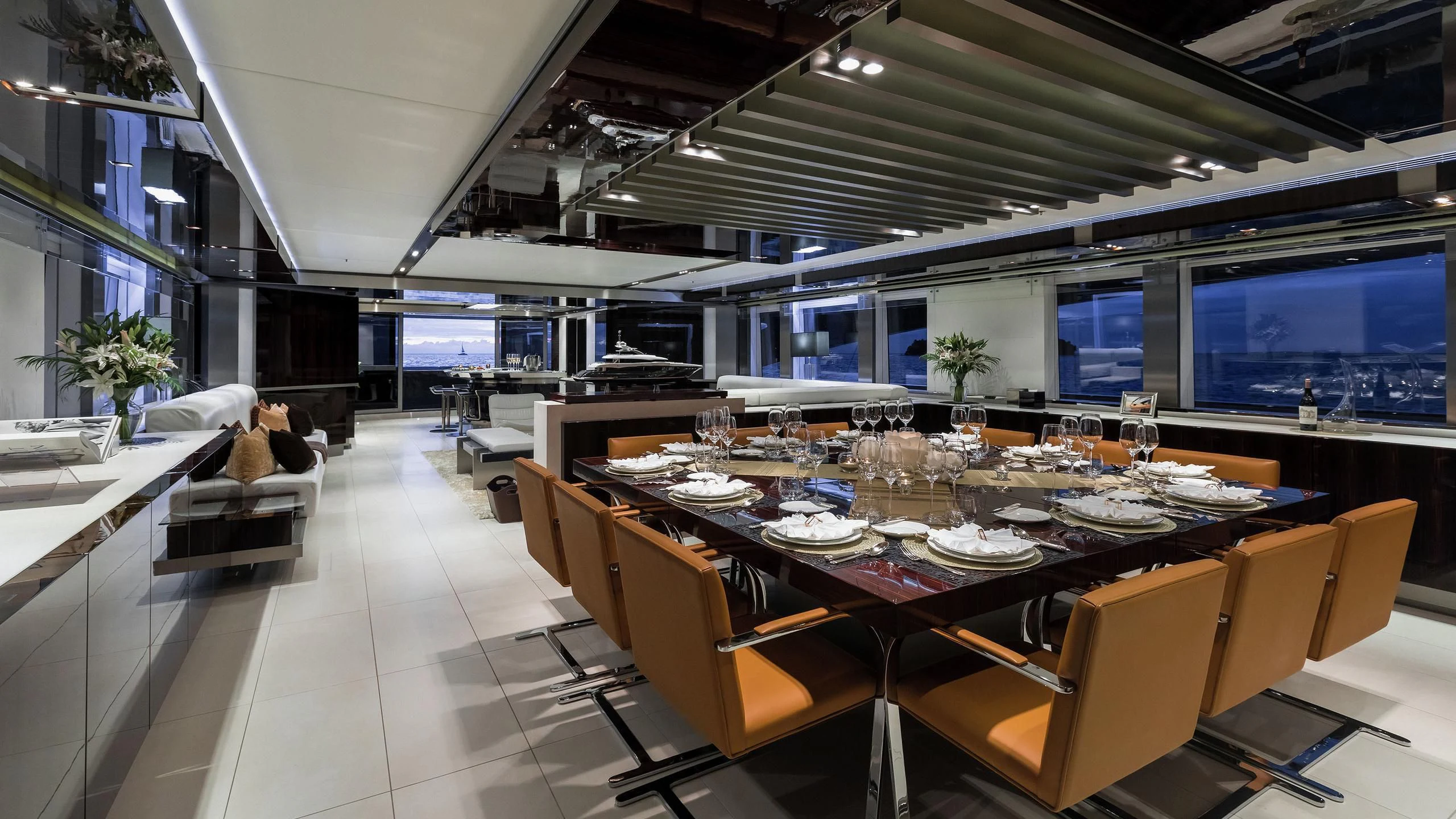 a large room with tables and chairs aboard TOTEM Yacht for Sale