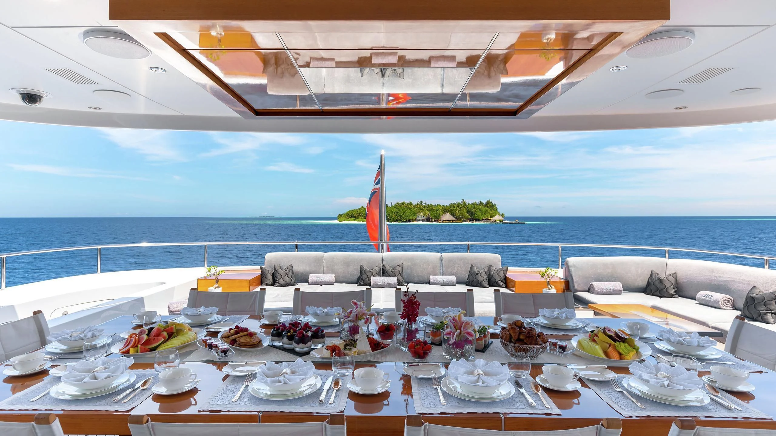 a table set for a dinner aboard TOTEM Yacht for Sale