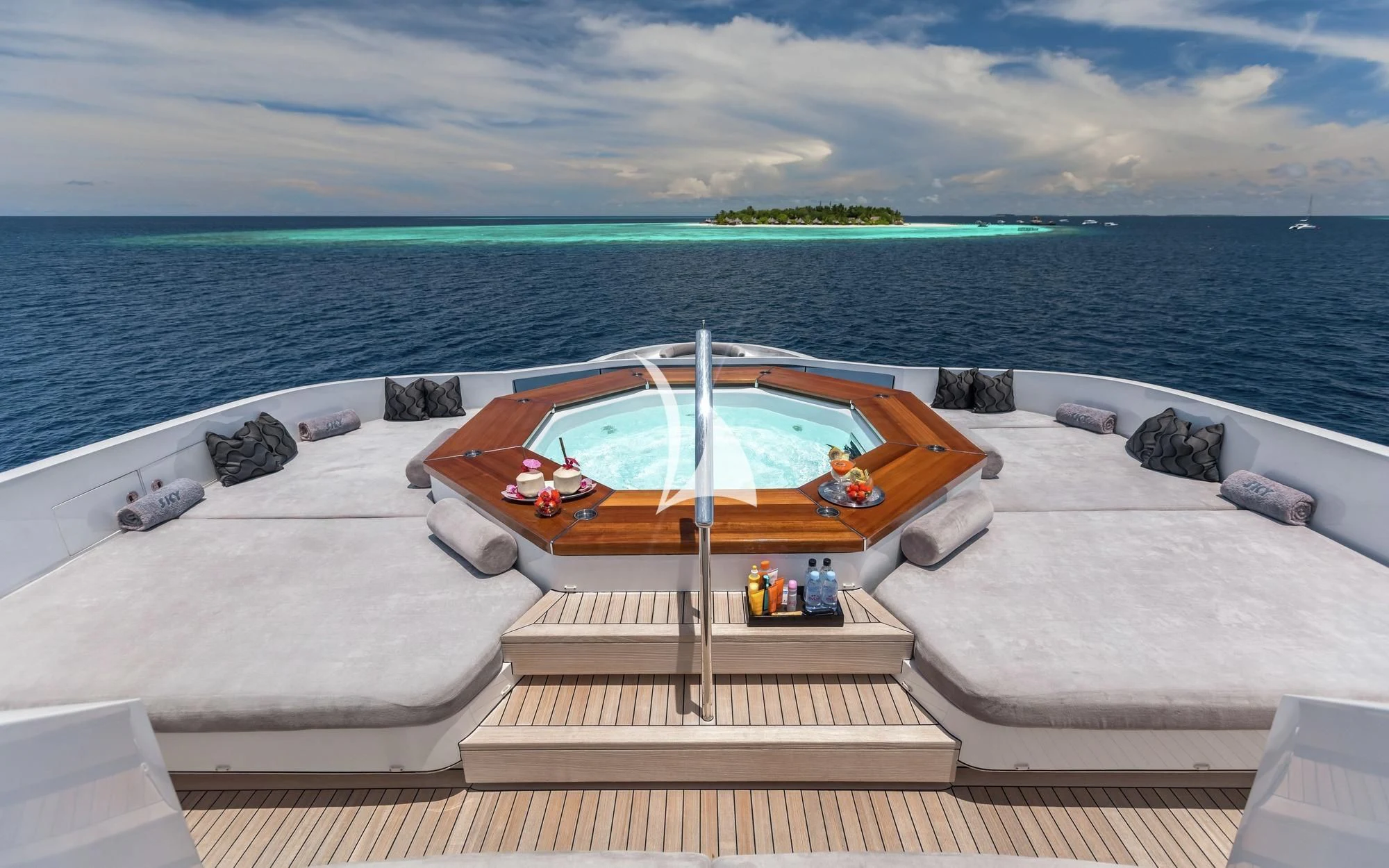 a lounge chair on a beach aboard TOTEM Yacht for Sale