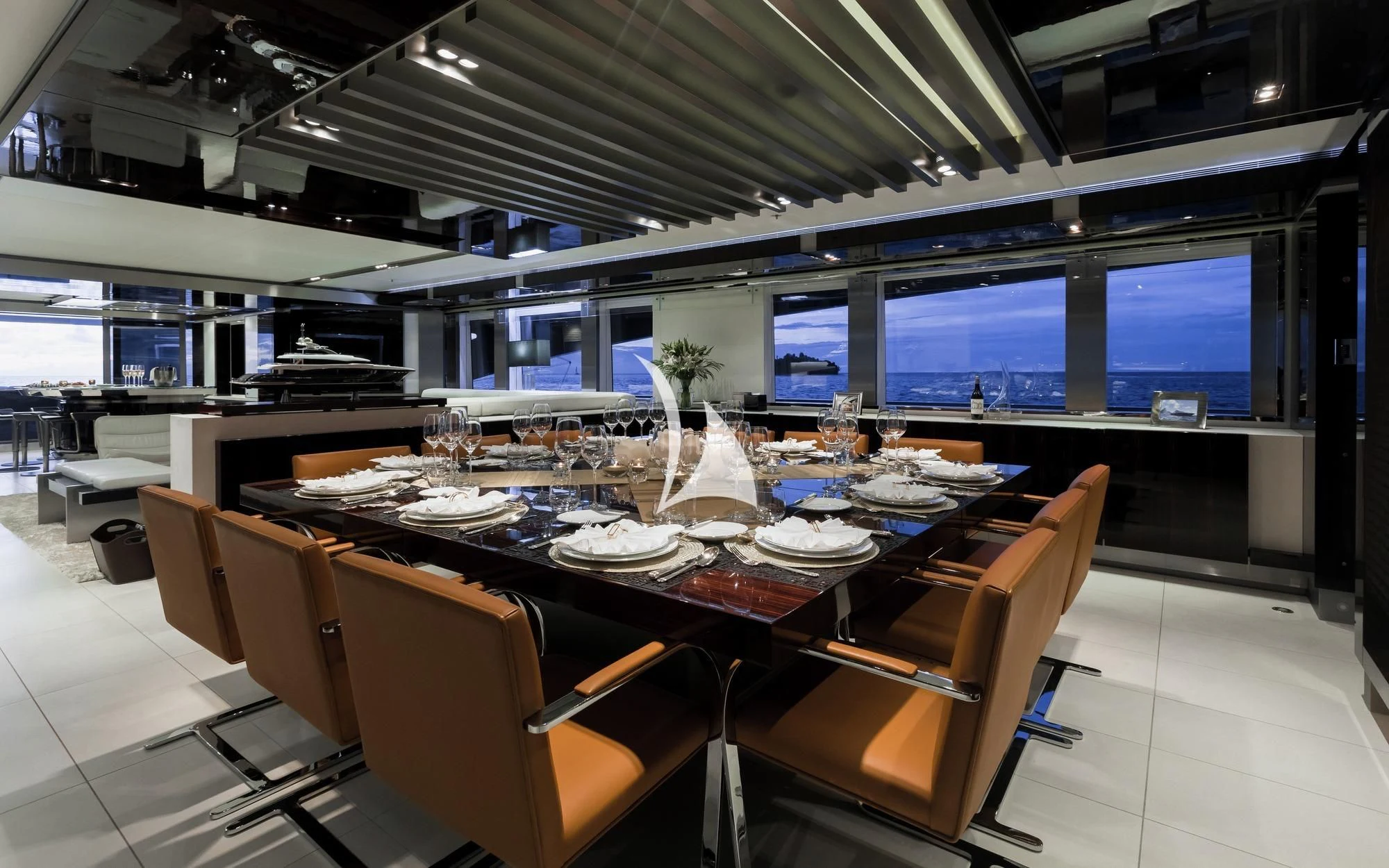 a large room with a table and chairs aboard TOTEM Yacht for Sale