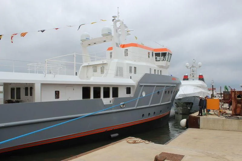 a couple of large boats docked aboard GENESIA Yacht for Sale