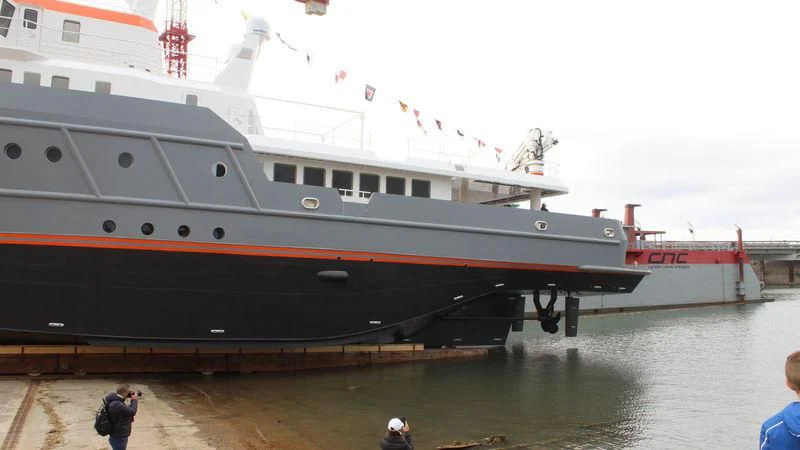 a large ship docked aboard GENESIA Yacht for Sale