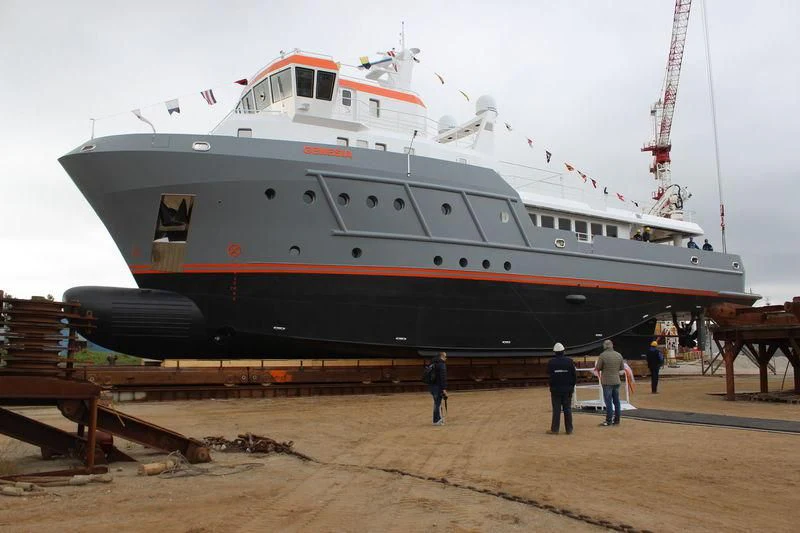 a large ship on a dock aboard GENESIA Yacht for Sale