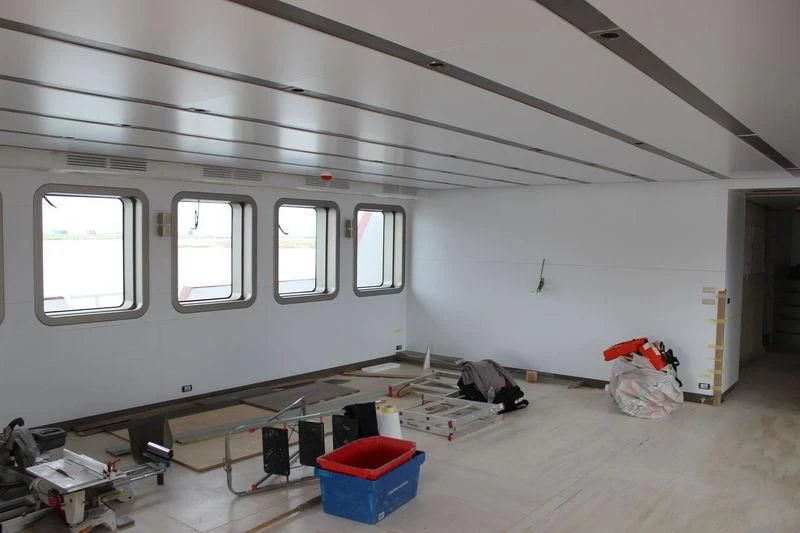 a room with a lot of tools and a window aboard GENESIA Yacht for Sale