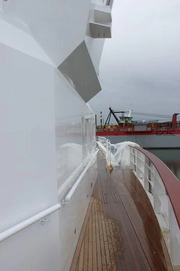 a long wooden bridge aboard GENESIA Yacht for Sale