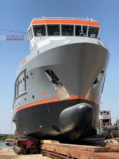 a large white and red boat aboard GENESIA Yacht for Sale