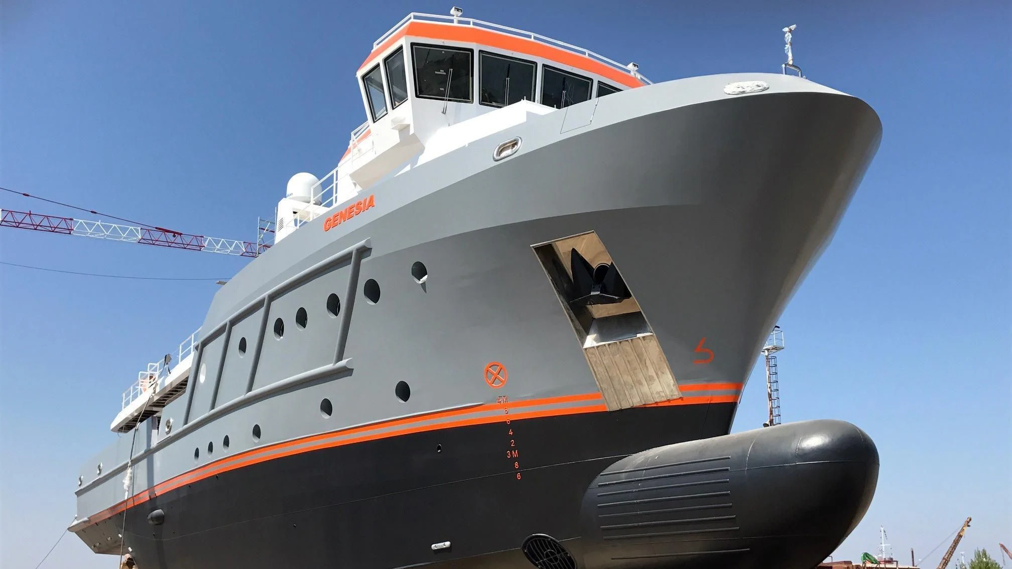 a large white and red boat aboard GENESIA Yacht for Sale