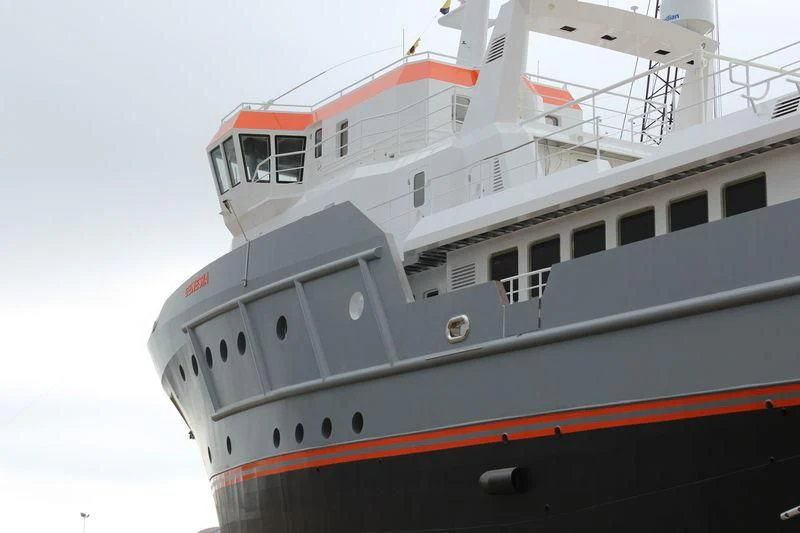 a large white boat aboard GENESIA Yacht for Sale