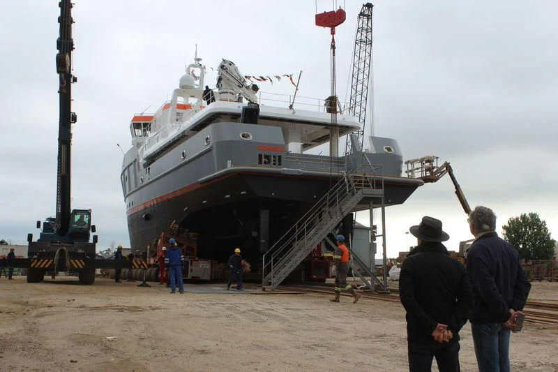 a large boat on a trailer aboard GENESIA Yacht for Sale